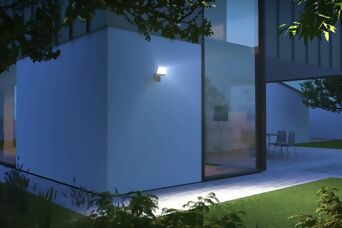 Éclairage extérieur intelligent avec projecteur LED, mise en lumière automatique pour jardins et façades modernes.